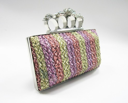 Skull finger rings woven PU clutch bag side view