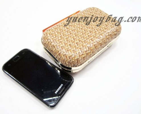 Woven PU leather day clutch bag with metal frame - contrast with mobile