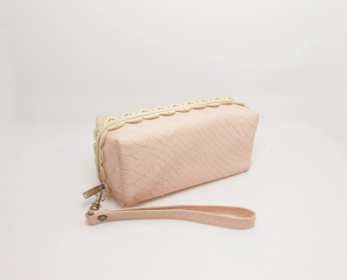 lady women's pink cosmetic wristlet bag